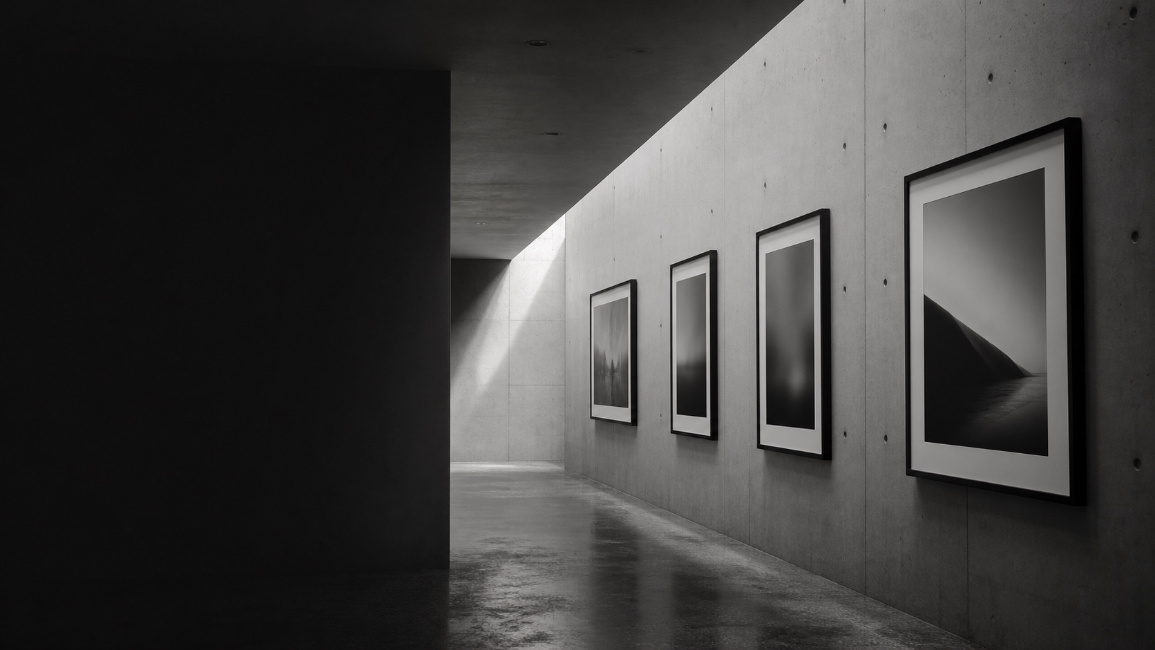 Monochrome gallery wall with framed photographic prints